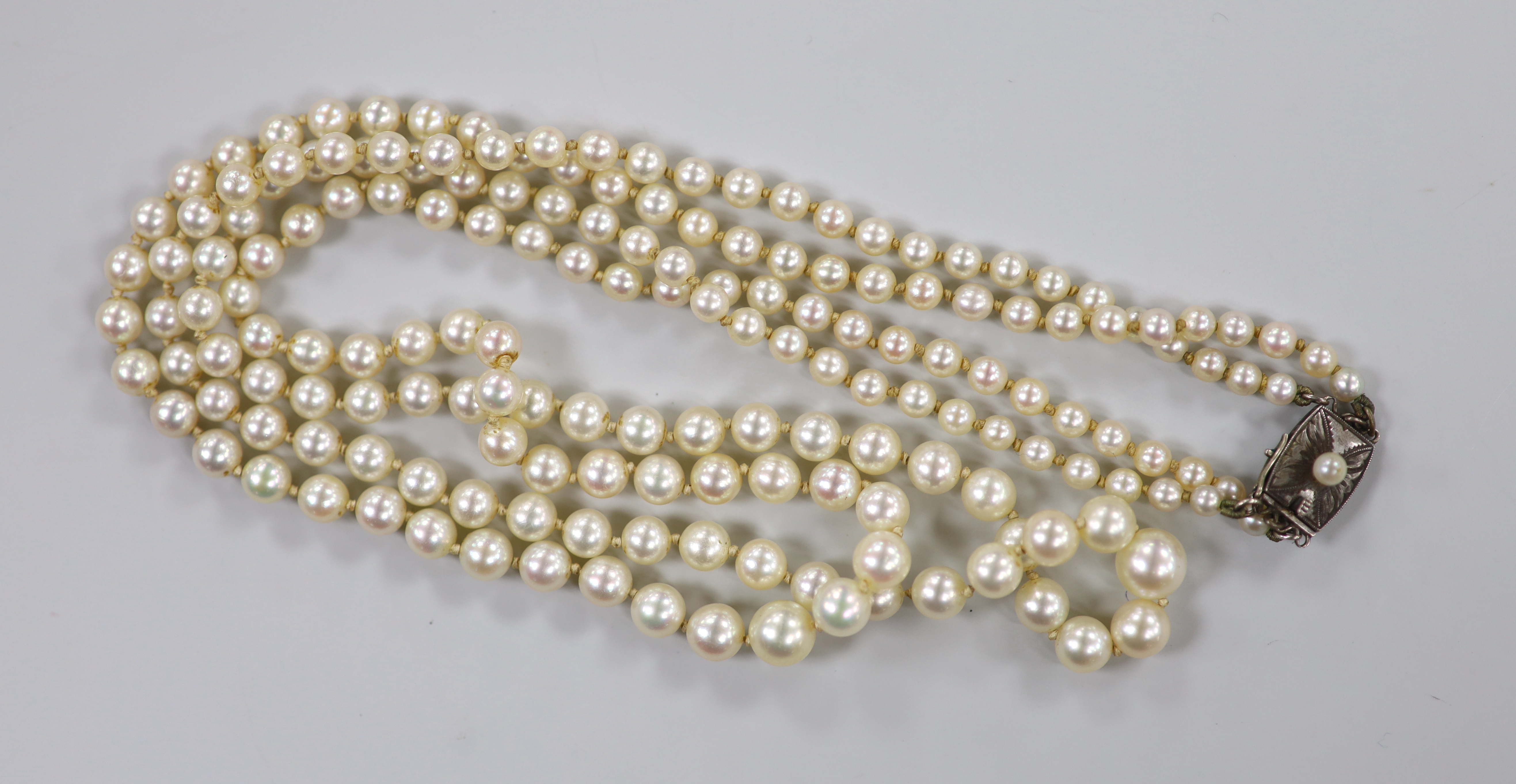 A Mikimoto double strand graduated cultured pearl necklace, with cultured pearl set white metal clasp, 48cm